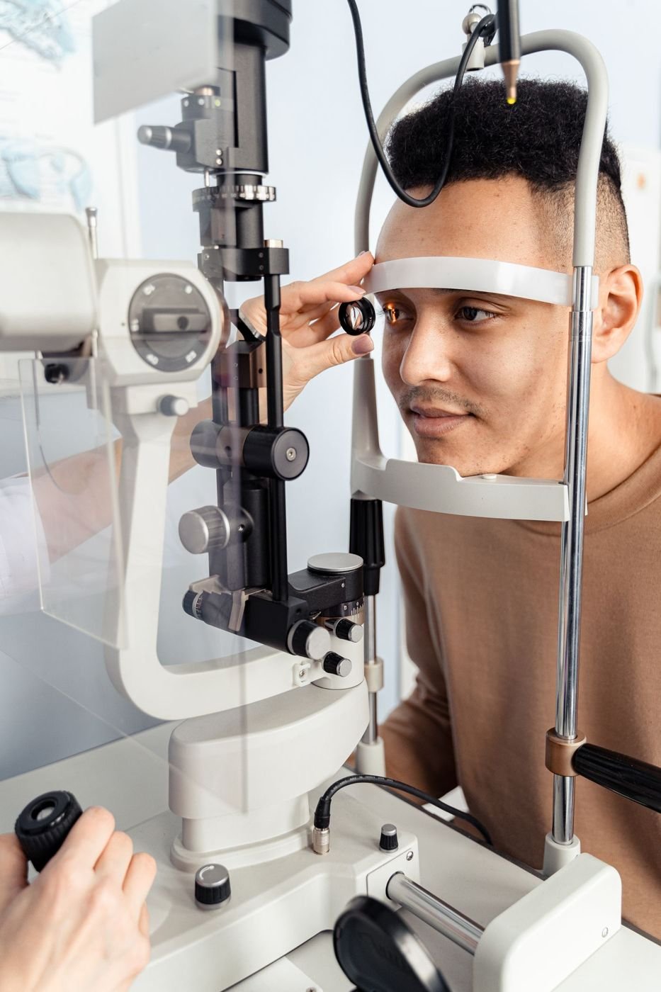 Patient having a slit lamp eye examination at an eye clinic