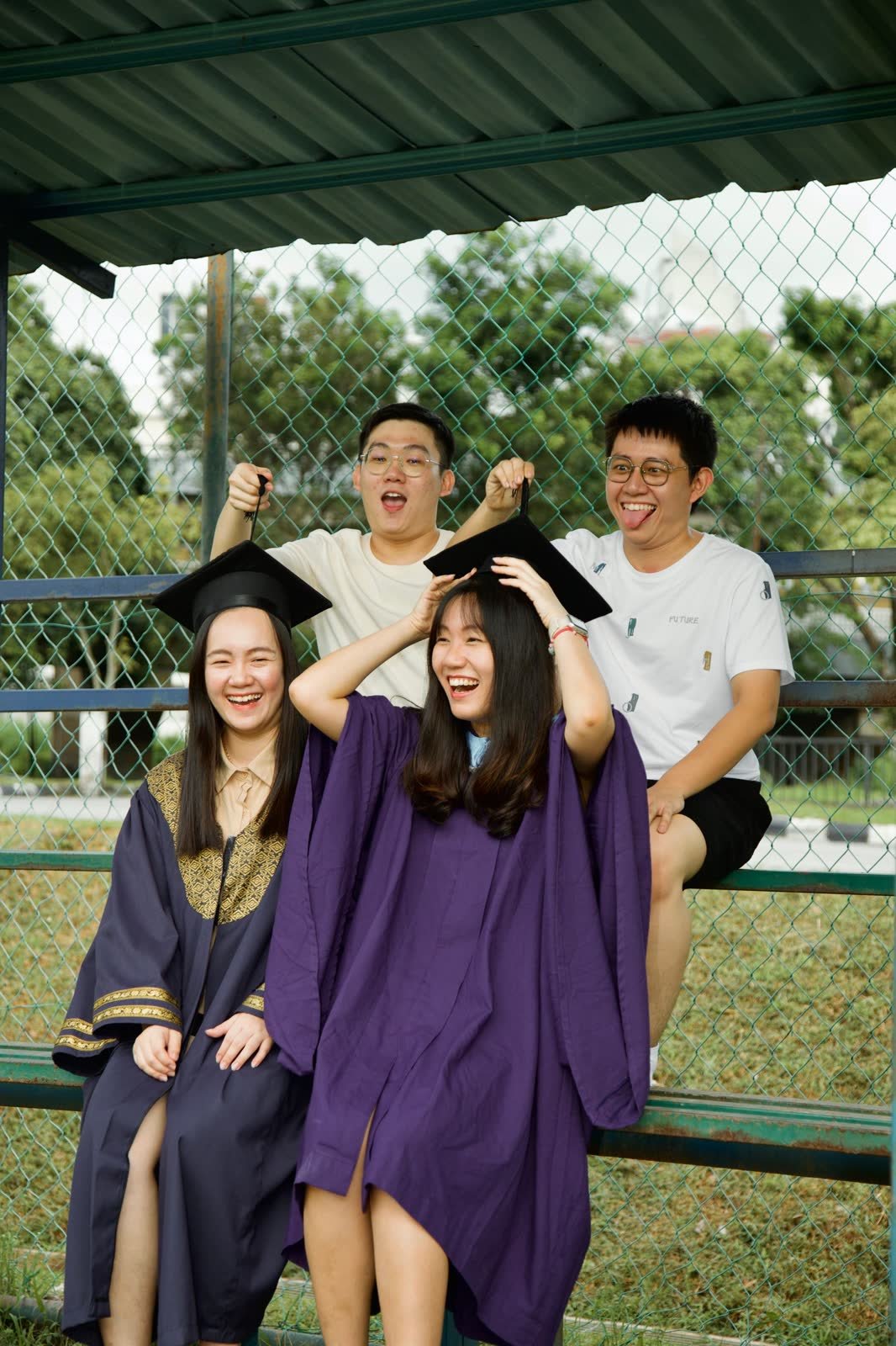 Graduates cheering after the ceremony