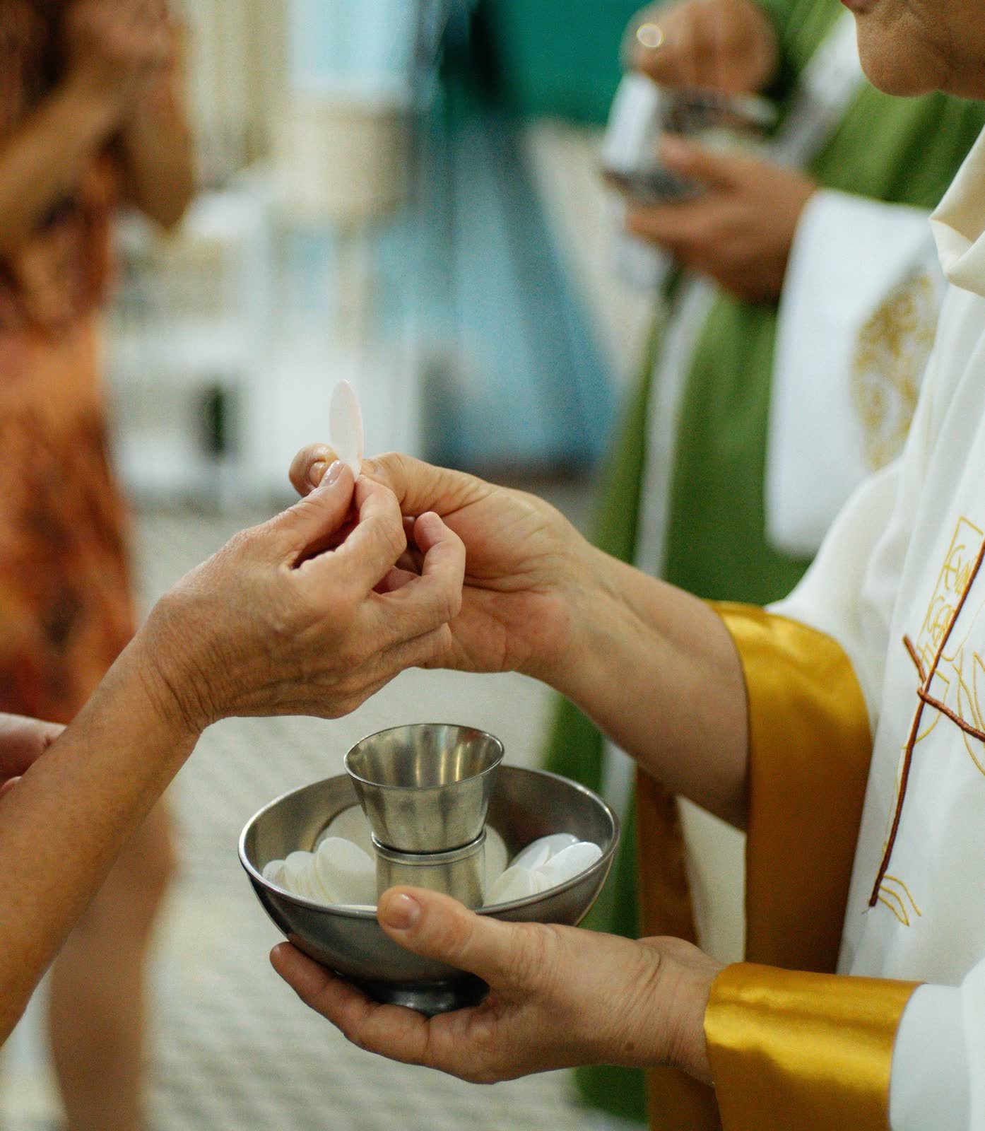 Priest and family during the blessing