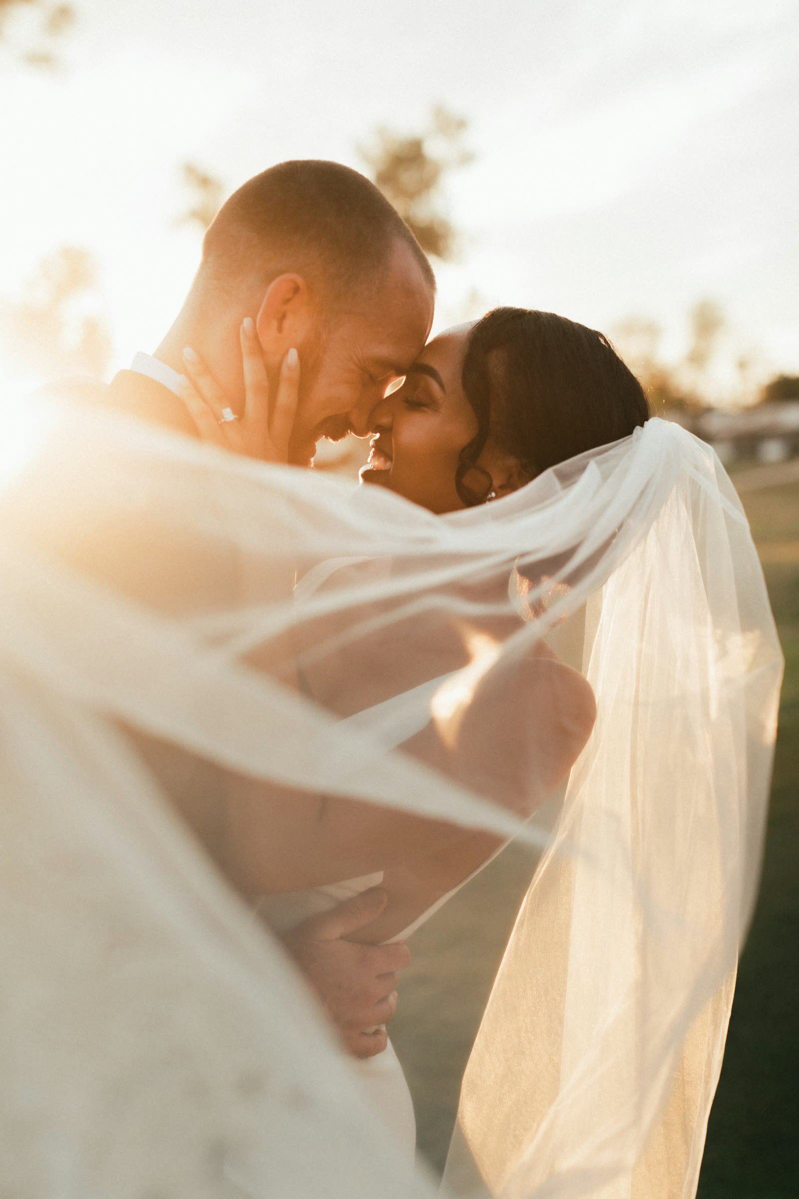 Bride and groom with her bouquet, smiling together
