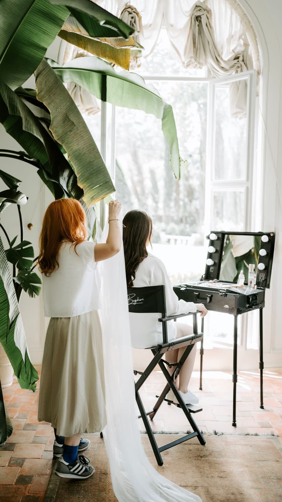 Bride getting ready with her makeup artist