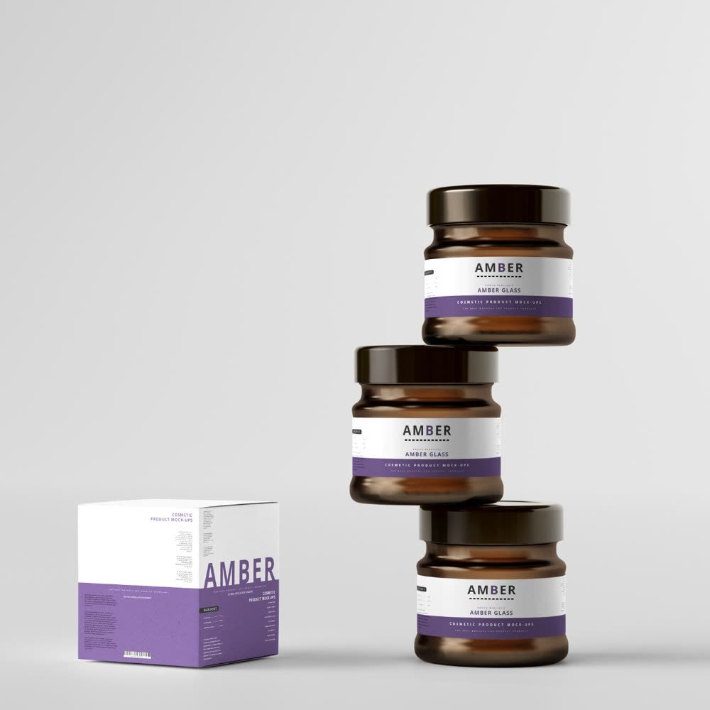 Stacked amber cosmetic jars beside their box
