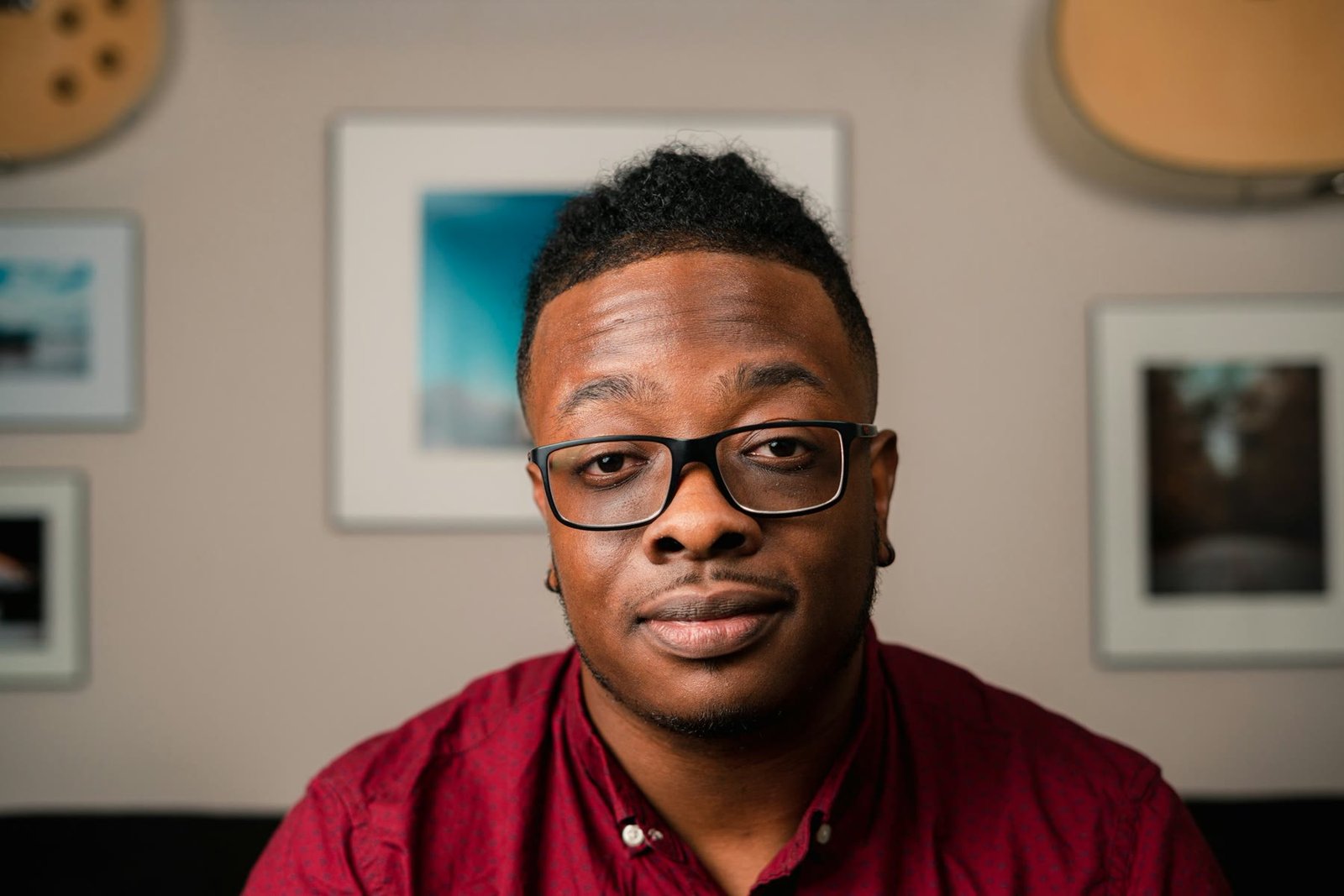Business headshot of a man with glasses in an office
