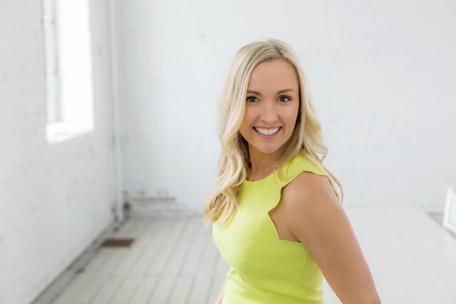 Smiling woman in a bright studio portrait