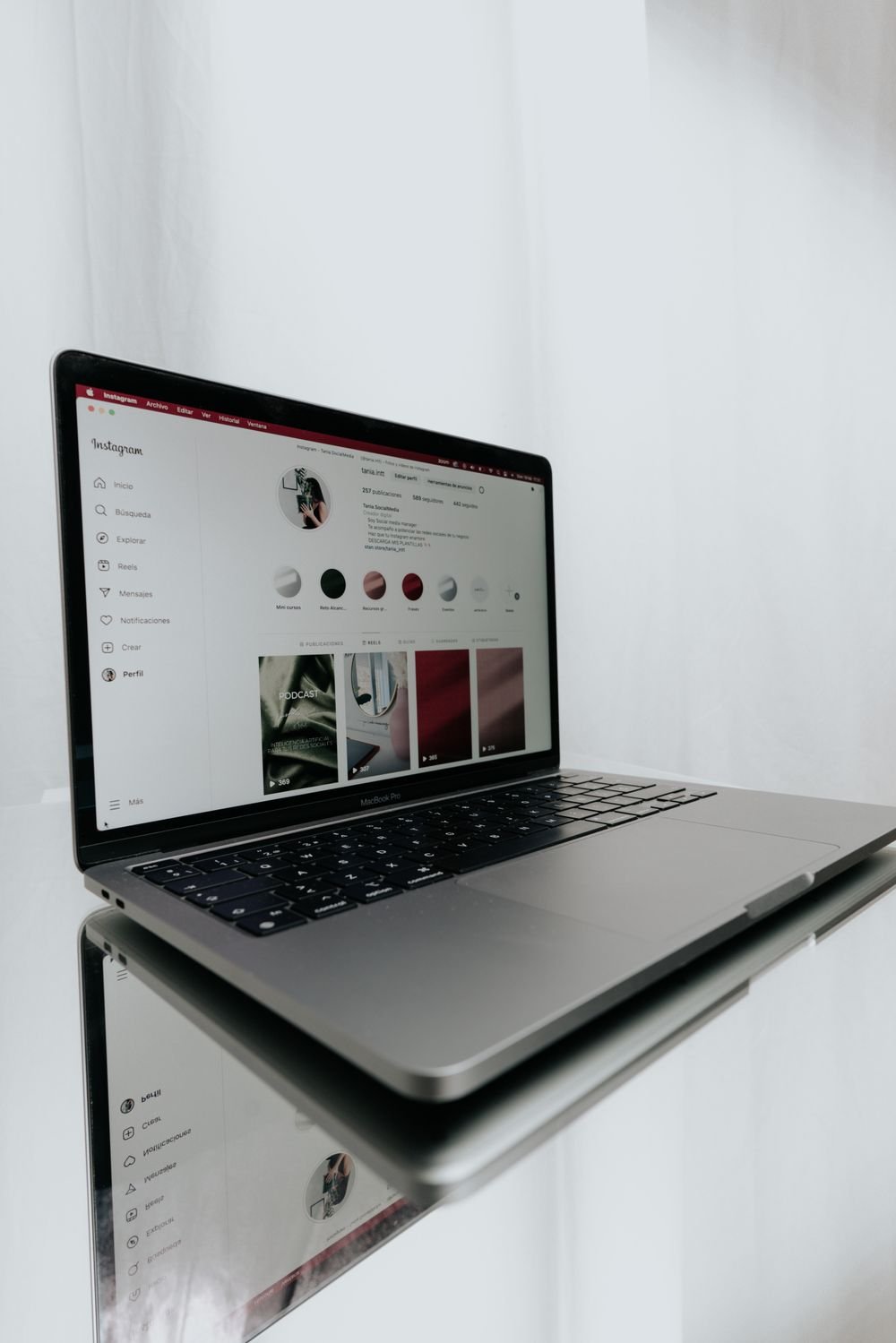 Laptop open on social content