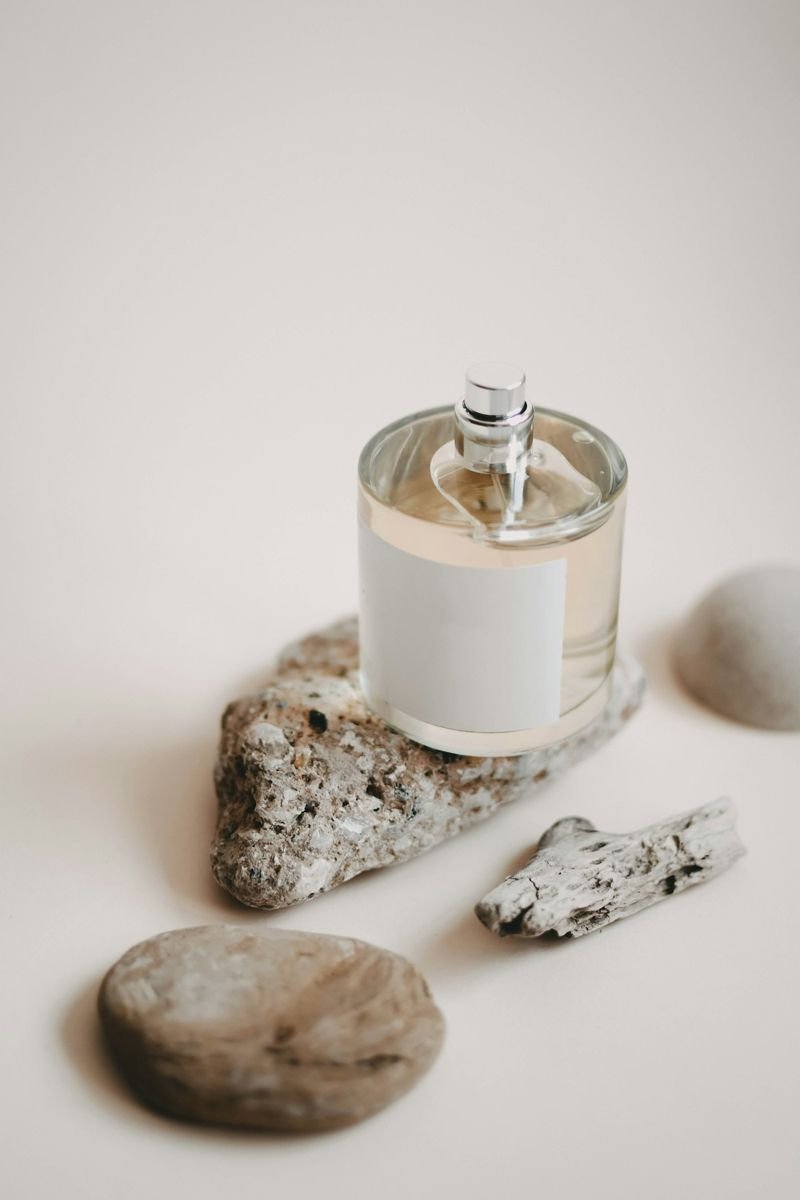 Unlabeled perfume bottle on a stone