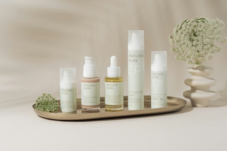 Skincare bottles styled on a tray