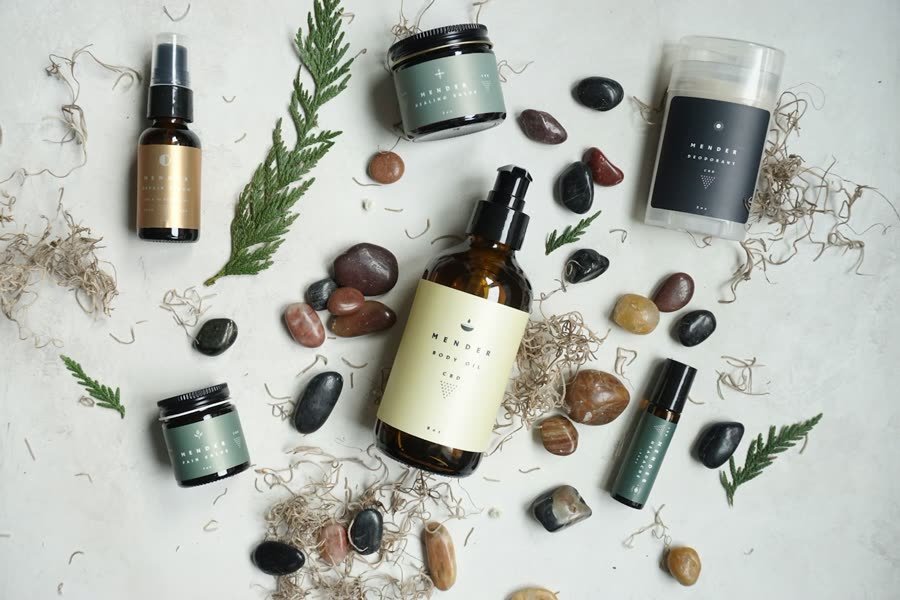 Skincare bottles and jars in a styled product flat lay