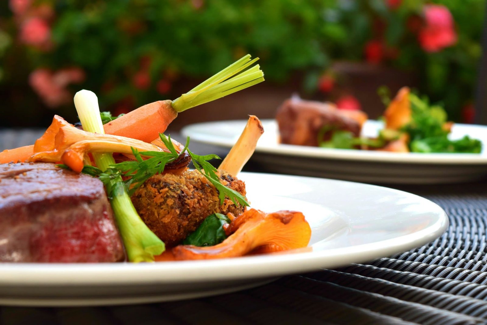 Plated steak with roasted vegetables, restaurant food photography