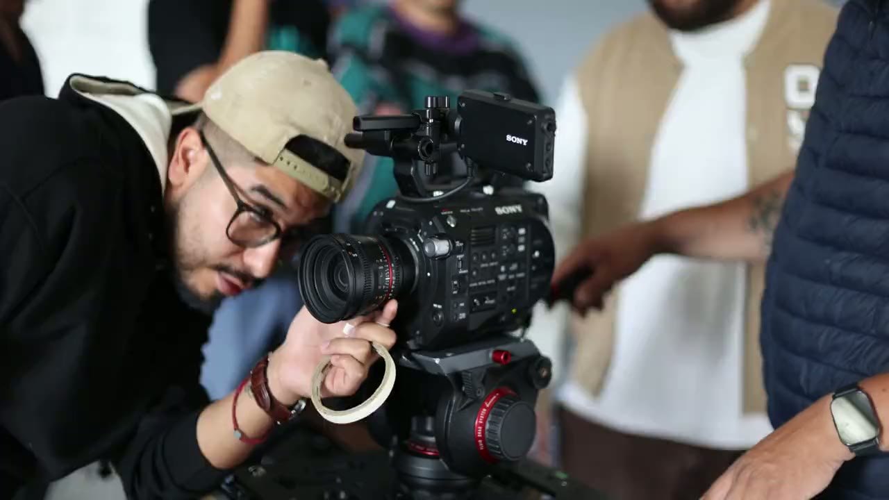 Videographer filming with a cinema camera